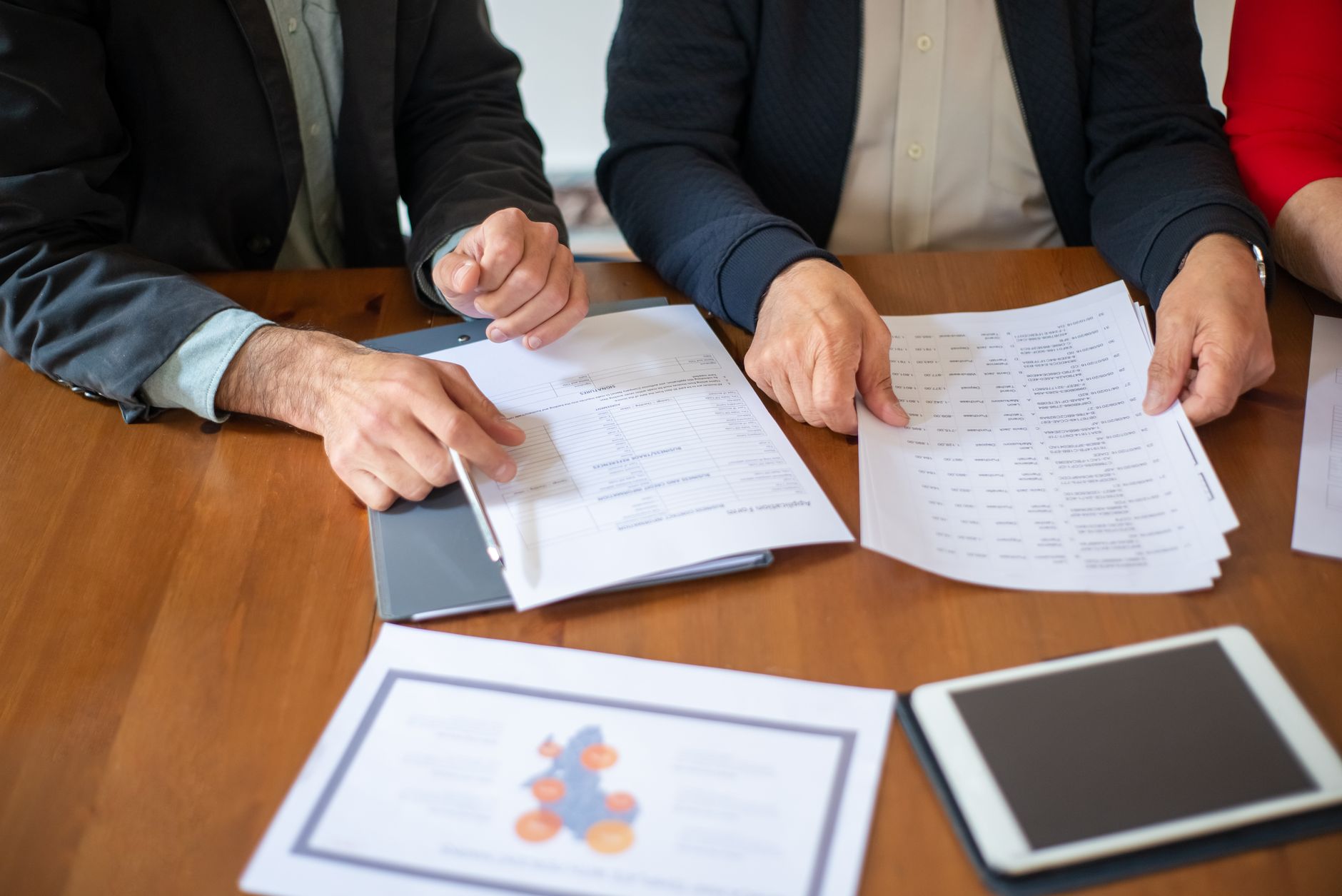 Community organisation worker assisting a client with a NILS loan application